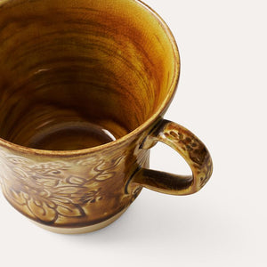 Inside view of the Sthal Arabesque Tea Mug in Pineapple colour – crackling of the reactive glaze shown.