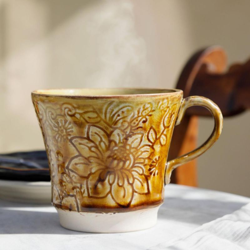 The 350 mL Sthal Arabesque Tea Mug in Pineapple glaze shown on a white background.