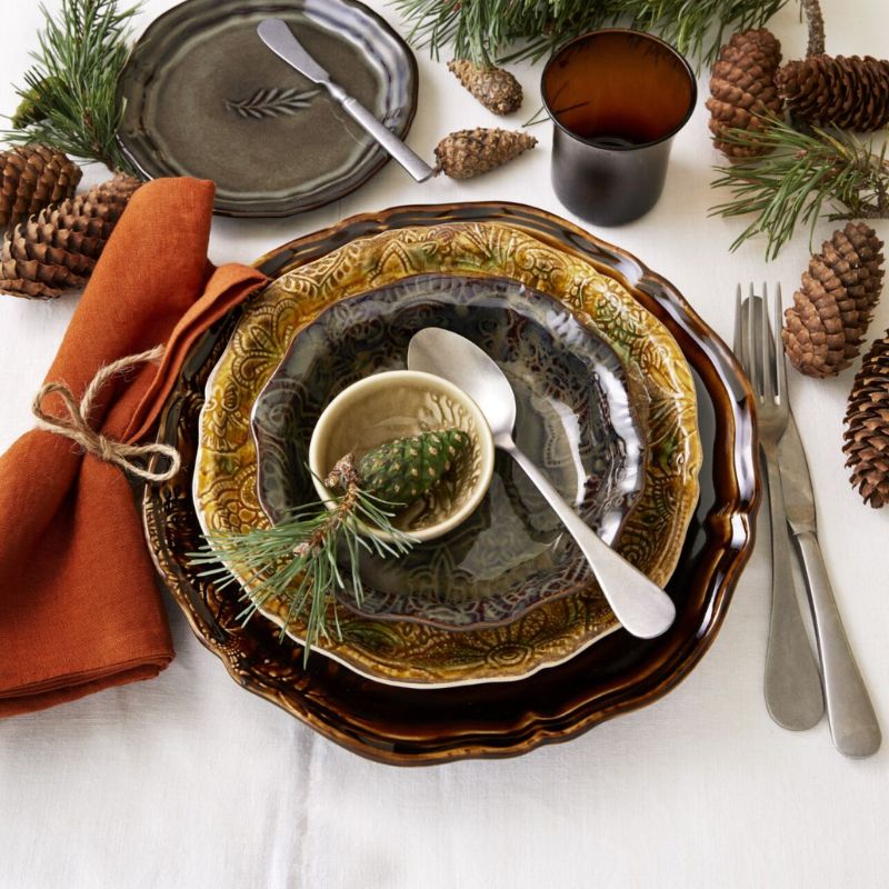 Sthal Arabesque Fig small bowl layered with other Arabesque plates in a table setting.