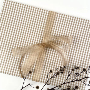 Taupe gingham wrapping paper with a champagne coloured ribbon