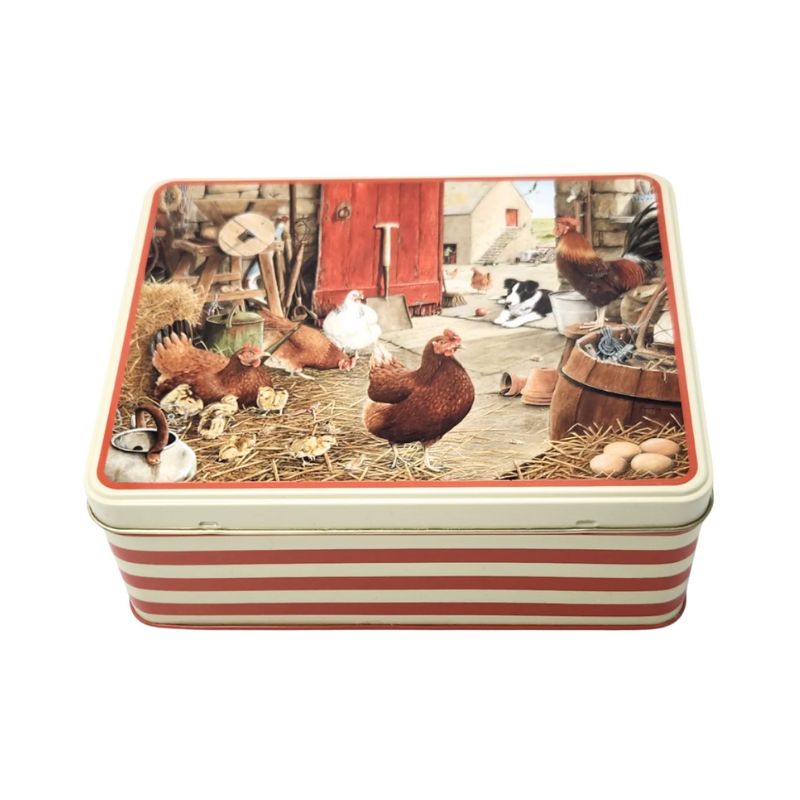 Tracy Hall Farmyard Hens Biscuit Tin showing hens and chicks in a barn with a border collie keeping guard - tin has red and white striped sides.