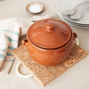 Natural cork trivet used under  terracotta casserole dish.