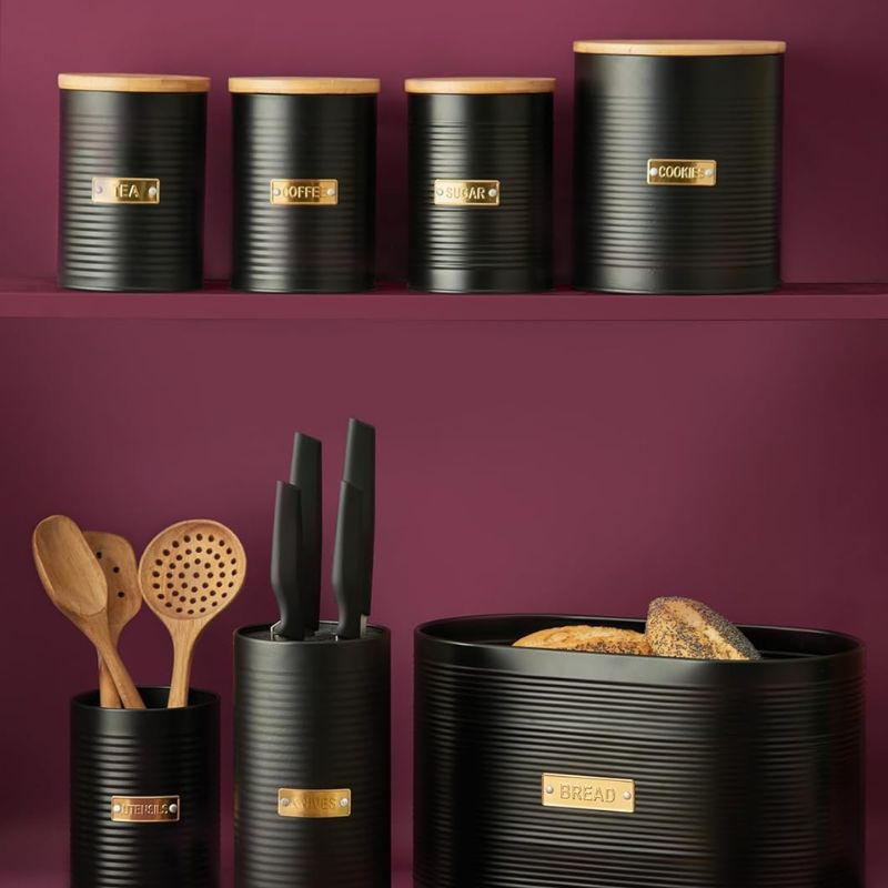 Typhoon Otto black ribbed tea canister with a bamboo lid and gold label.