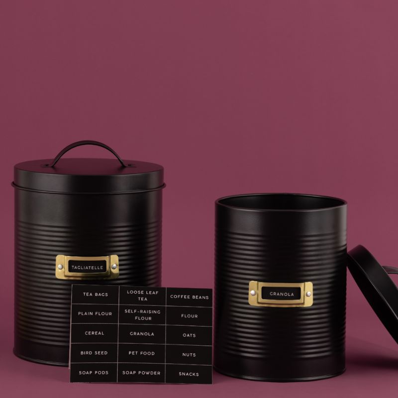 Two black Typhoon Otto storage canisters shown with label options on a pink background