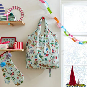 Ulster Weavers Christmas Cats Oven Mitt  hanging next to a matching bag.