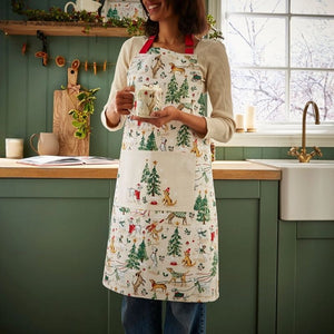 Person wearing the Ulster Weavers Winter Walkies Cotton Apron in a kitchen