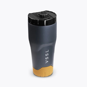 VSSL Rift Tumbler - Ash, with a  black lid, and a yellow base, shown on a light gray background.