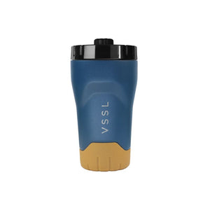 VSSL Rift Tumbler in Pacific Blue 295mL with a tan textured base, and a black lid, shown on a plain white background.