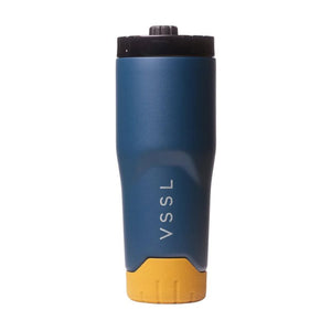 VSSL Rift Tumbler in Pacific Blue 590mL with a tan textured base, and a black lid, shown on a plain white background.