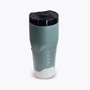 VSSL Rift Tumbler in Wild Sage featuring a black lid with a flip-top design and a white textured base, shown on a light gray background.