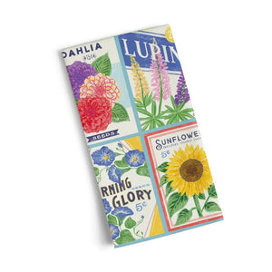 WerkShoppe Cotton Tea Towel – Seed Packets shown folded on a white background.