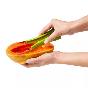 Westmark Fruit Cutter – 3 Piece Set being used to scoop fruit from a halved papaya