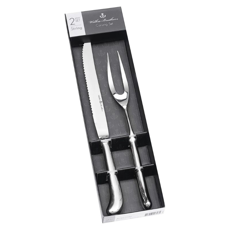 Wilkie Brothers Stirling Carving Set with fork and matching knife shown against a solid white background.