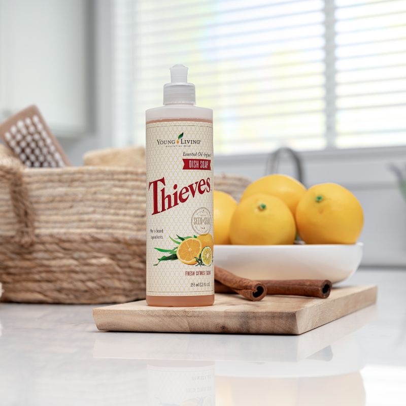 Bottle of Young Living Thieves Dish Soap in a natural kitchen