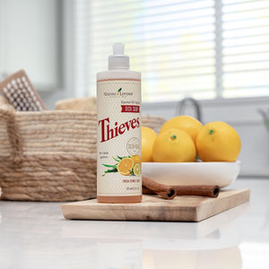Bottle of Young Living Thieves Dish Soap in a natural kitchen