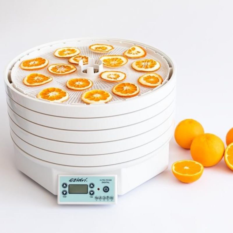 Ezidri FD1000 Digital Dehydrator loaded with sliced oranges - top tray open view with digital control panel visible.