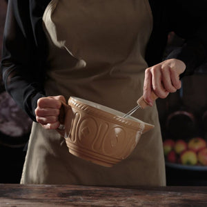 Person holding the Mason Cash Cane Batter Bowl.