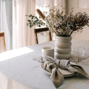 Raine & Humble Mason Bee linen table cloth in sky grey and na[kins in stone